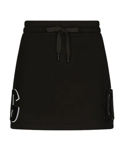 Dolce & Gabbana Jersey Miniskirt With Logo Patch In Black