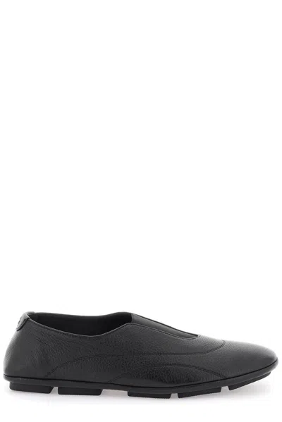 Dolce & Gabbana Logo Embossed Loafers In Nero (black)
