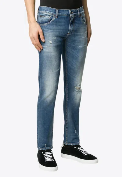 Dolce & Gabbana Logo Patch Distressed Faded Jeans In Blue