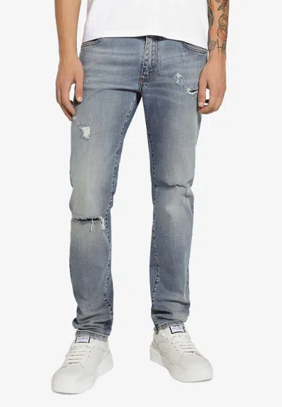 Dolce & Gabbana Logo Plaque Distressed Slim Jeans In Blue