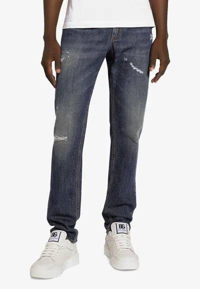 Dolce & Gabbana Logo Plaque Distressed Washed Jeans In Blue