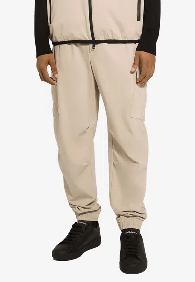 Dolce & Gabbana Logo Plaque Drawstring Cargo Pants In Beige