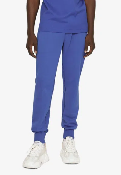Dolce & Gabbana Logo Plaque Drawstring Track Pants In Blue