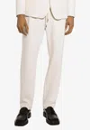 Dolce & Gabbana Logo Plaque Drawstring Track Pants In Cream