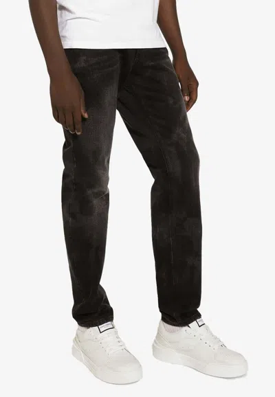 Dolce & Gabbana Logo Plaque Faded Jeans In Gray