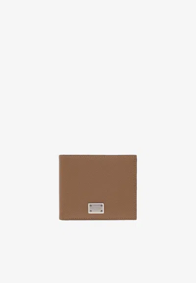 Dolce & Gabbana Logo Plaque Grained Leather Bi-fold Wallet In Brown