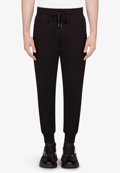 Dolce & Gabbana Logo Plate Cotton Track Pants In Black