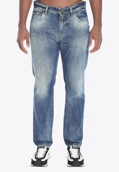 Dolce & Gabbana Logo Tag Distressed Jeans In Blue