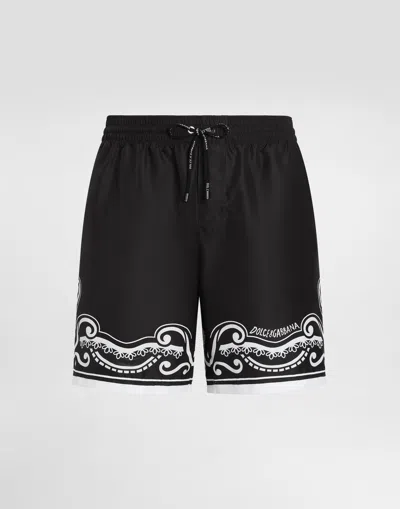 DOLCE & GABBANA MID-LENGTH SWIM TRUNKS WITH BANDANNA PRINT