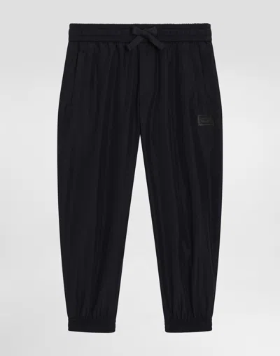 Dolce & Gabbana Nylon Jogging Pants With Branded Tag In Blue