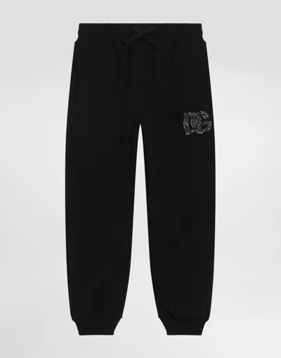 Dolce & Gabbana Kids' Oversized Fleece Trousers With Dg Logo And Rhinestones In Black