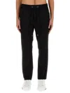 Dolce & Gabbana Jogging Pants With Plaque Detail In Black