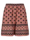 Dolce & Gabbana Pink Bermuda Shorts With Dg Logo Printed All-over In Silk Woman In Pink