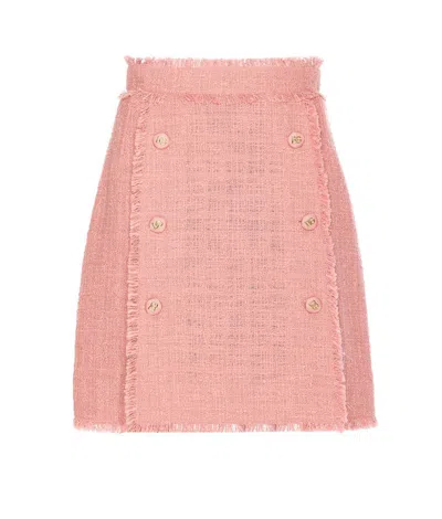 DOLCE & GABBANA PINK SKIRT WITH LOGOED BUTTONS AND FRAYED EDGES