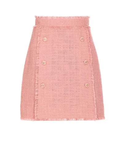 DOLCE & GABBANA PINK SKIRT WITH LOGOED BUTTONS AND FRAYED EDGES IN COTTON TWEED WOMAN
