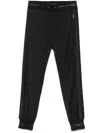 Dolce & Gabbana Pinstriped Tapered Trousers In Black