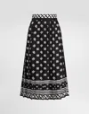 Dolce & Gabbana Skirt With All-over Dg Logo In Black