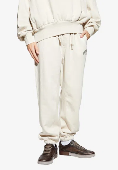 Dolce & Gabbana Printed Logo Sweatpants In Neutral