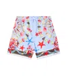 Dolce & Gabbana Shell-print Swim Shorts In Blue