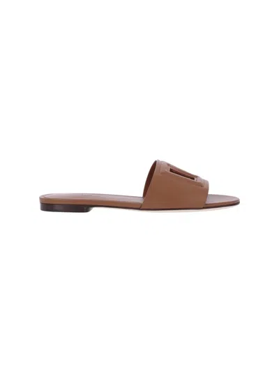 Dolce & Gabbana Slide Sandals With Cut Out Logo In Leather Woman In Brown
