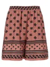 Dolce & Gabbana Pink Bermuda Shorts With Dg Logo Printed All-over In Silk Woman