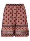 Dolce & Gabbana Pink Bermuda Shorts With Dg Logo Printed All-over In Silk Woman
