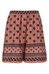 Dolce & Gabbana Pink Bermuda Shorts With Dg Logo Printed All-over In Silk Woman