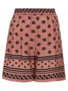 Dolce & Gabbana Pink Bermuda Shorts With Dg Logo Printed All-over In Silk Woman In Pink