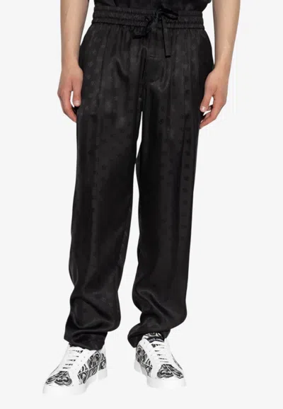 Dolce & Gabbana Silk Embossed Monogram Trousers In Black