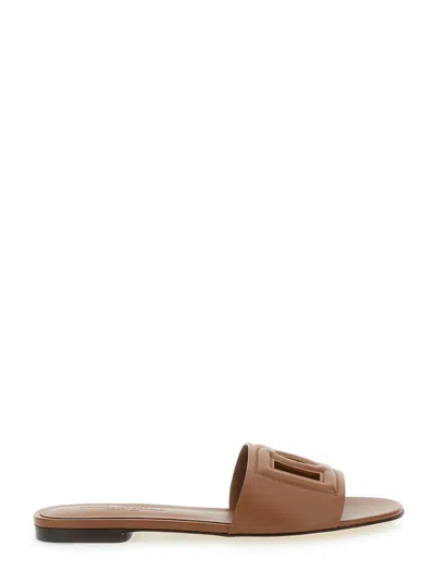Dolce & Gabbana Slide Sandals With Cut Out Logo In Leather Woman In Brown