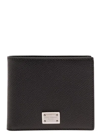 DOLCE & GABBANA BLACK BI-FOLD WALLET WITH LOGO PLAQUE ON THE FRONT IN GRAINED LEATHER MAN