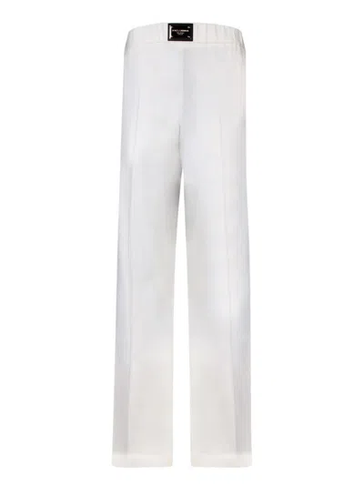 Dolce & Gabbana Flare Trousers With Logo Plaque In White