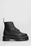 Dr. Martens Sinclair Combat Boot In Black Hammered Leather With A Large Treaded Sole In Animal Print