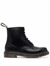 DR. MARTENS' STIVALI STRINGATI 1460 IN PELLE LISCIA