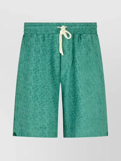 DRÔLE DE MONSIEUR LOGO PATTERNED SHORTS FEATURING POCKETS