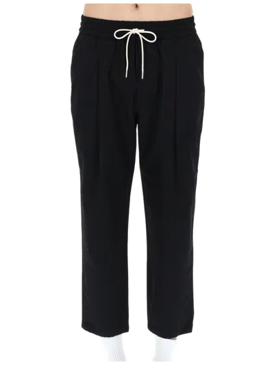 Drôle De Monsieur Relaxed Fit Cropped Trousers With Tapered Leg And Contrasting Drawstring In Black