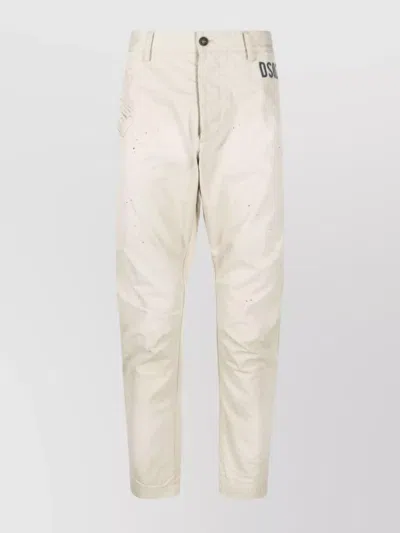 DSQUARED2 CHINO TROUSERS WITH TAPERED LEG AND GRAPHIC PRINT