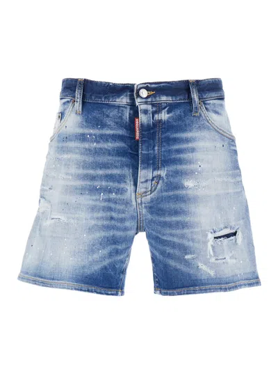 DSQUARED2 BLUE JEANS WITH DISTRESSED EFFECT AND LOGO PATCH ON THE BACK IN DENIM MAN