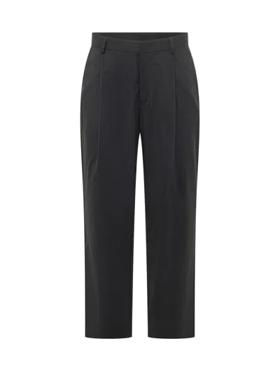 Duno Carrot Cut Trousers In Navy