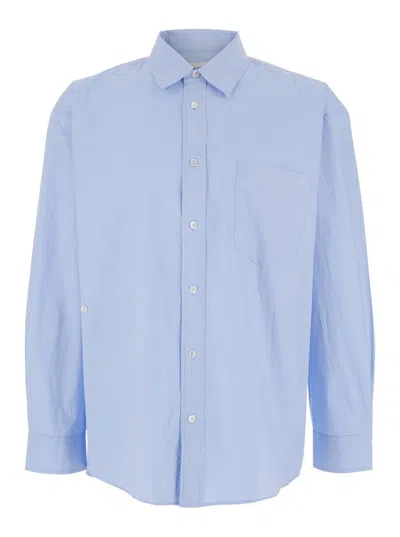 DUNST LIGHT BLUE SHIRT WITH PATCH POCKET ON THE FRONT AND EMBROIDERED LOGO IN COTTON POPLIN MAN