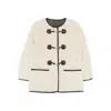 Dunst Collarless Buckled Shearling Jacket Cream In Black