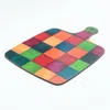 E. Inder Designs Chopping Paddle And Teapot Stand In Colours Of The Rainbow To Bring A Smile To The Cook.