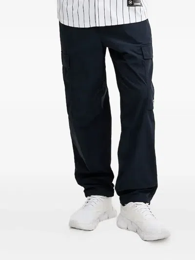 Ea7 Embossed-logo Cargo Trousers In White