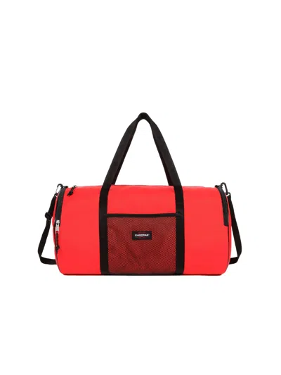 Eastpak X Telfar Large Duffel Logo Patch Duffle Bag In Orange