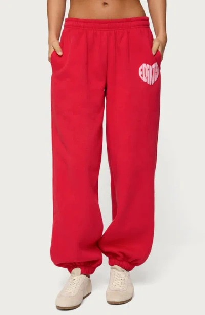 Edikted Major Love Fleece Logo Graphic Sweatpants In Red