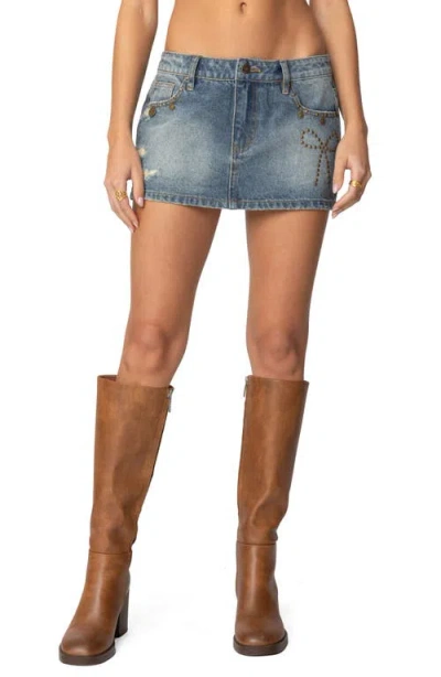 Edikted Studded Bow Distressed Denim Miniskirt In Blue