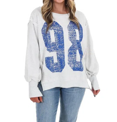 Eesome Faded Varsity Print Pullover Top In Vanilla Bean In White