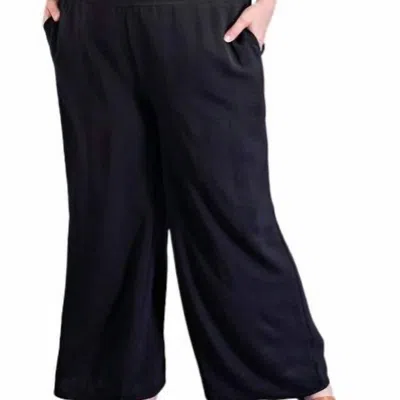 EESOME WIDE LEG WITH SMOCKED WAIST PANTS IN BLACK