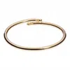 Eklexic Women's Knob Ended Bangle In Gold In Gold