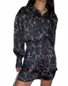 Elan Cassie Long Sleeve Romper In Black Marble In Blue